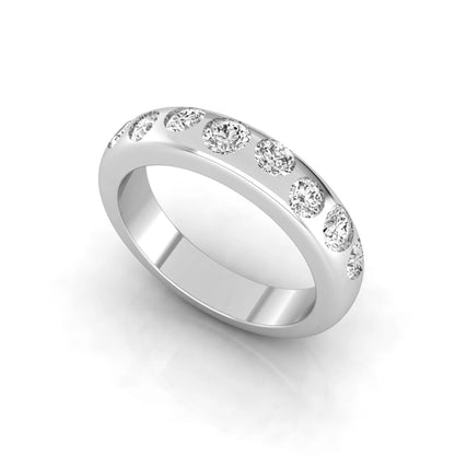 Flush set round cut lab grown diamond wedding band in polished white gold with a modern comfort-fit design.