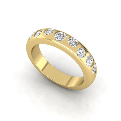 Flush set round cut lab grown diamond wedding band in polished yellow gold with a modern comfort-fit design.