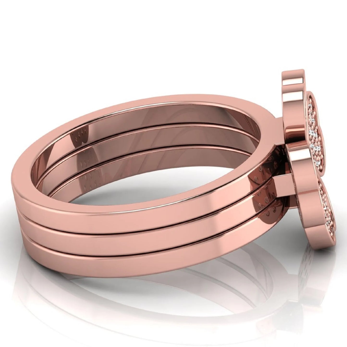 Three-ring lab grown diamond set featuring a four-heart clover motif with pavé round diamonds on polished rose gold style bands.