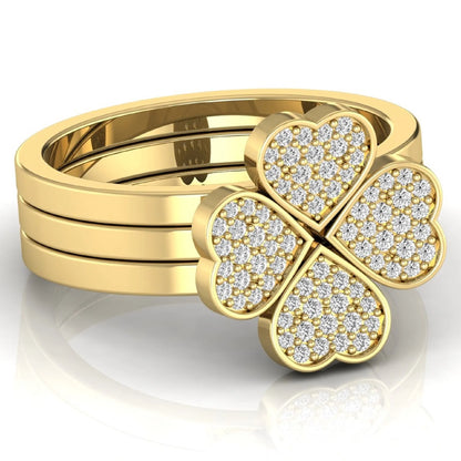 Three-ring lab grown diamond set featuring a four-heart clover motif with pavé round diamonds on polished yellow gold style bands.