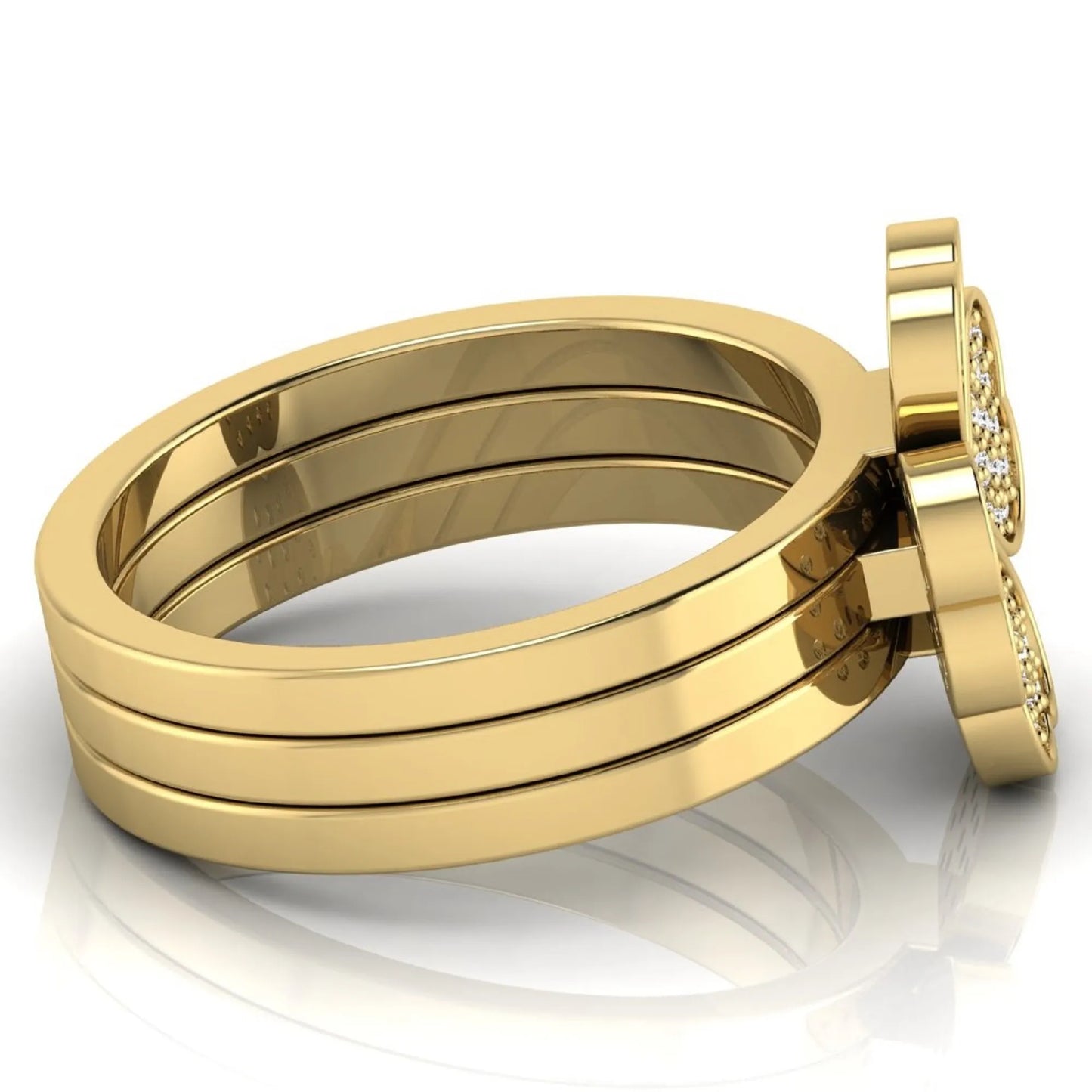 Three-ring lab grown diamond set featuring a four-heart clover motif with pavé round diamonds on polished yellow gold style bands.