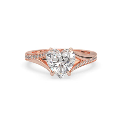 Rose gold ring with a heart-shaped lab grown diamond on a white background