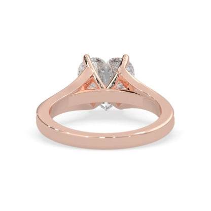 Rose gold ring with a lab grown  diamond on a white background