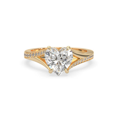 yellow Gold ring with a heart-shaped diamond on a white background