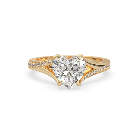 yellow Gold ring with a heart-shaped diamond on a white background