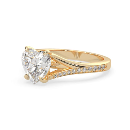 yellow Gold ring with a heart-shaped diamond on a white background