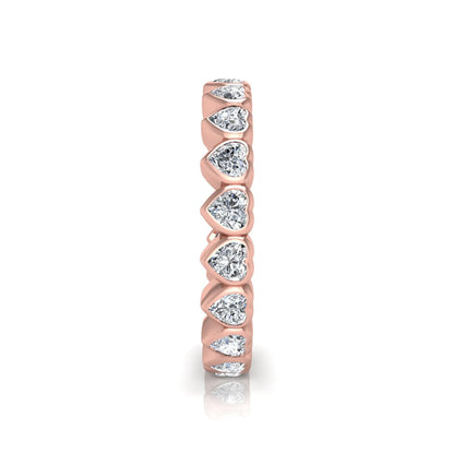 Heart cut lab grown diamond eternity band featuring 3.20 carats of heart-shaped diamonds in a shared-prong setting with a polished rose gold finish.