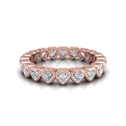 Heart cut lab grown diamond eternity band featuring 3.20 carats of heart-shaped diamonds in a shared-prong setting with a polished rose gold finish.