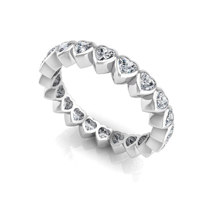 Heart cut lab grown diamond eternity band featuring 3.20 carats of heart-shaped diamonds in a shared-prong setting with a polished white gold finish.