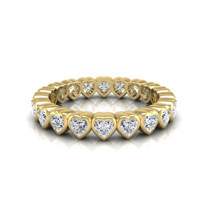 Heart cut lab grown diamond eternity band featuring 3.20 carats of heart-shaped diamonds in a shared-prong setting with a polished yellow gold finish.