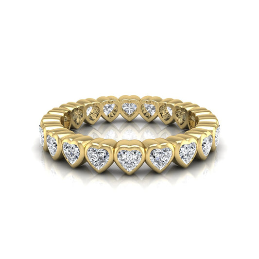Heart cut lab grown diamond eternity band featuring 3.20 carats of heart-shaped diamonds in a shared-prong setting with a polished yellow gold finish.