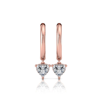 Heart cut lab grown diamond drop huggie hoop earrings featuring a three prong drop setting, hinged snap closure, and polished rose gold tone finish.
