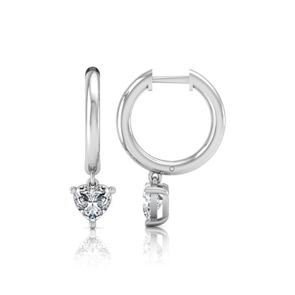 Heart cut lab grown diamond drop huggie hoop earrings featuring a three prong drop setting, hinged snap closure, and polished white gold tone finish.