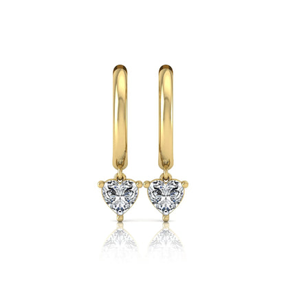 Heart cut lab grown diamond drop huggie hoop earrings featuring a three prong drop setting, hinged snap closure, and polished yellow gold tone finish.