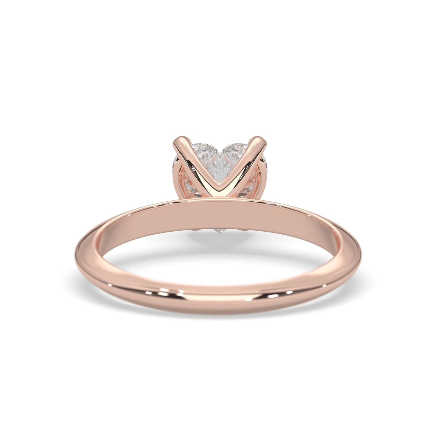 Rose-gold ring with a heart-shaped diamond design on a white background