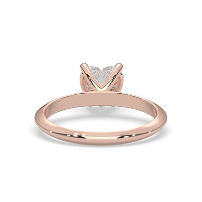Rose-gold ring with a heart-shaped diamond design on a white background
