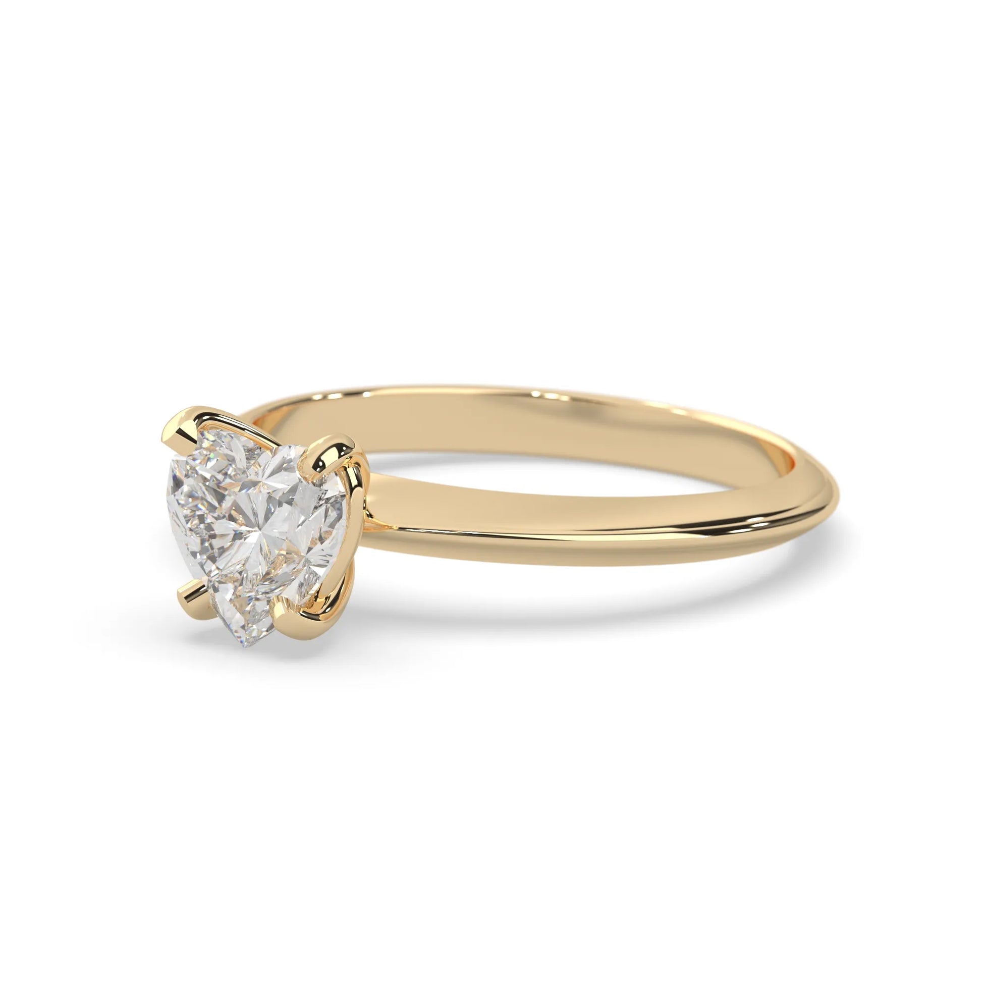 yellow-Gold ring with a pear-shaped diamond on a white background