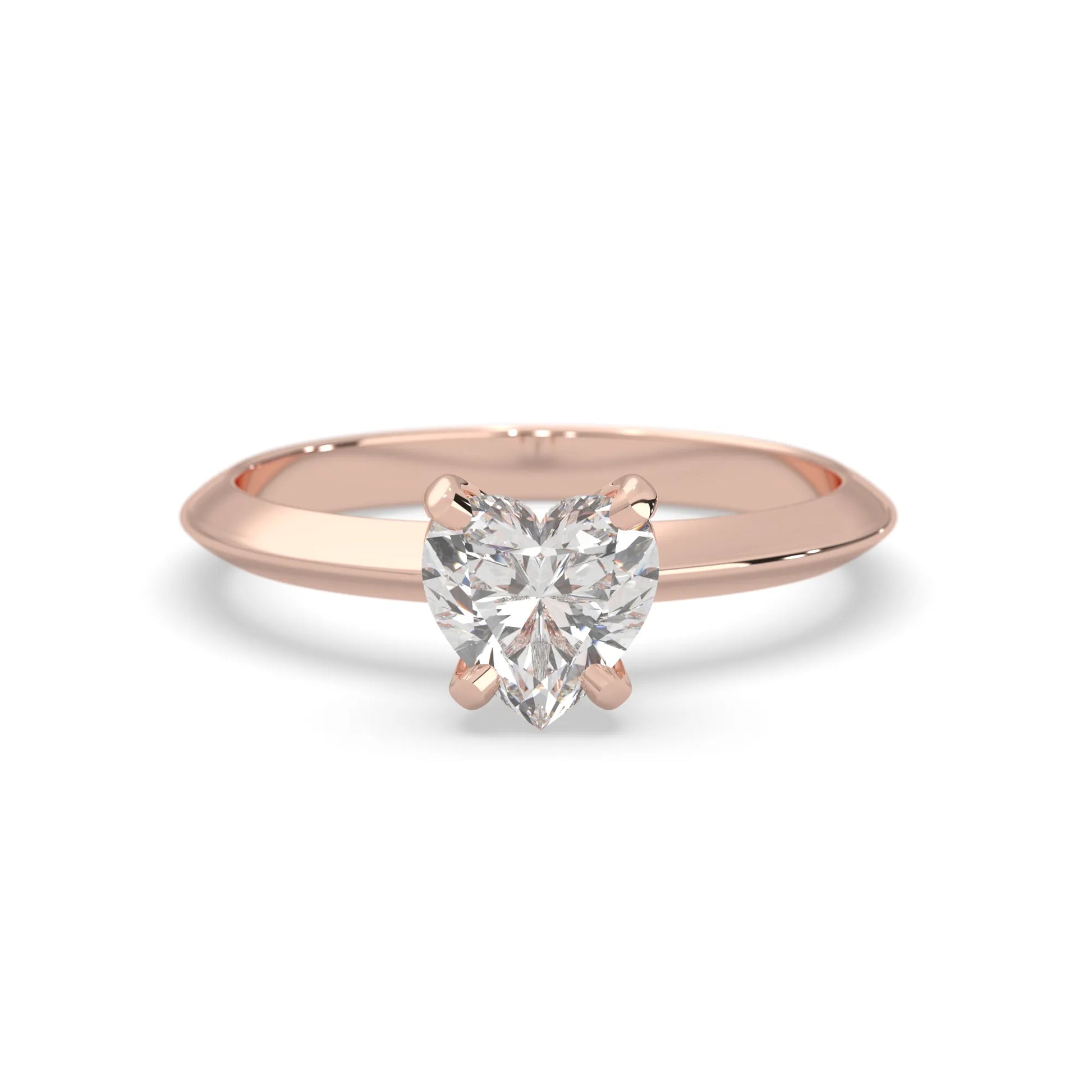Rose-gold ring with a heart-shaped diamond on a white background
