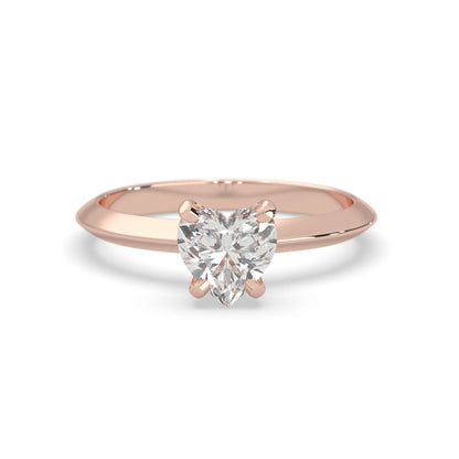 Rose-gold ring with a heart-shaped diamond on a white background