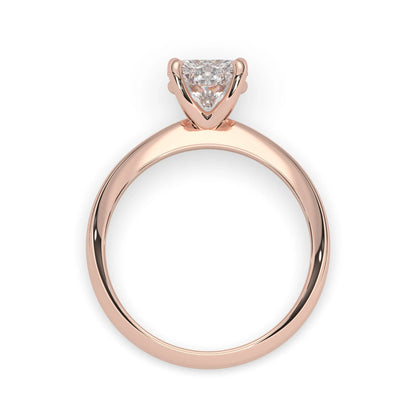 Rose-gold ring with a diamond on a white background