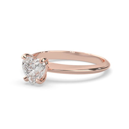 Rose-gold ring with a pear-shaped diamond on a white background