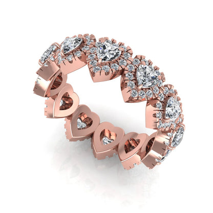 Heart halo lab grown diamond eternity band featuring heart cut diamonds surrounded by round diamond halos in a luxurious full eternity design in rose gold