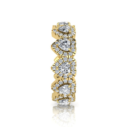 Heart halo lab grown diamond eternity band featuring heart cut diamonds surrounded by round diamond halos in a luxurious full eternity design in yellow gold
