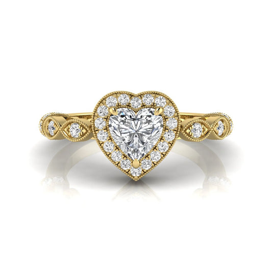 Heart cut halo lab grown diamond engagement ring with round diamond halo, infinity-inspired band, and yellow gold metal tone.