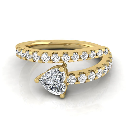 Heart cut lab grown diamond double wrap ring with pavé round diamond bands in polished yellow gold.