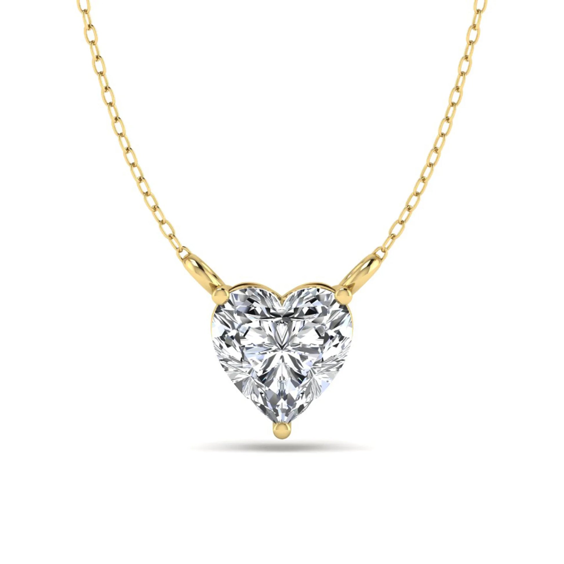 Heart cut lab grown diamond solitaire pendant necklace in three-prong setting with yellow gold tone chain