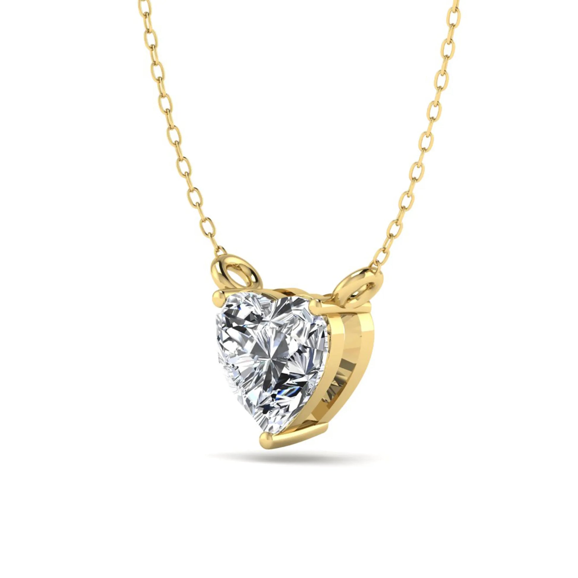 Heart cut lab grown diamond solitaire pendant necklace in three-prong setting with yellow gold tone chain