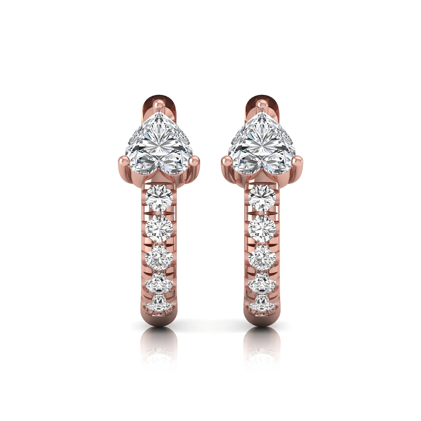 Heart cut lab grown diamond huggie hoop earrings featuring a three prong basket set center diamond with round brilliant pavé diamonds on a rose gold hoop.