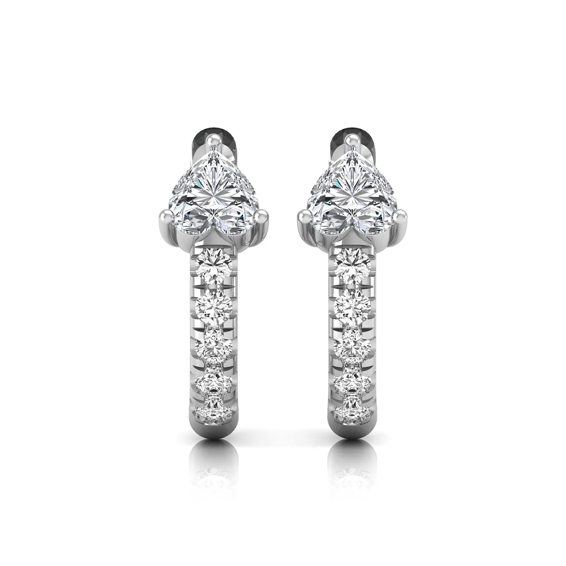 Heart cut lab grown diamond huggie hoop earrings featuring a three prong basket set center diamond with round brilliant pavé diamonds on a white gold hoop.
