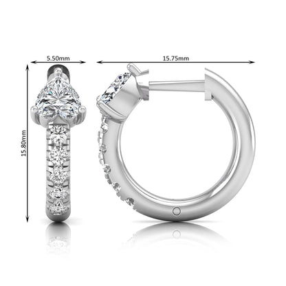 Heart cut lab grown diamond huggie hoop earrings featuring a three prong basket set center diamond with round brilliant pavé diamonds on a white gold hoop.