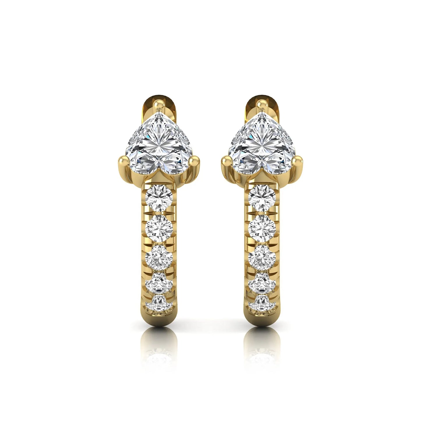 Heart cut lab grown diamond huggie hoop earrings featuring a three prong basket set center diamond with round brilliant pavé diamonds on a yellow gold hoop.
