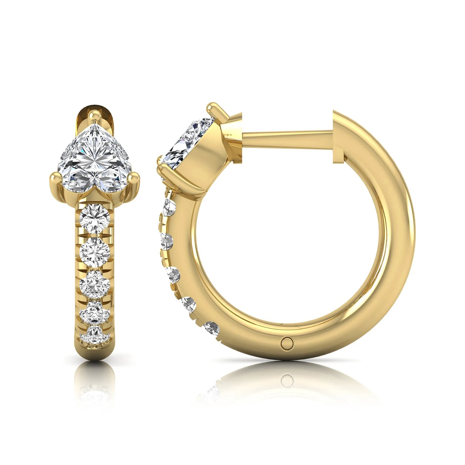 Heart cut lab grown diamond huggie hoop earrings featuring a three prong basket set center diamond with round brilliant pavé diamonds on a yellow gold hoop.