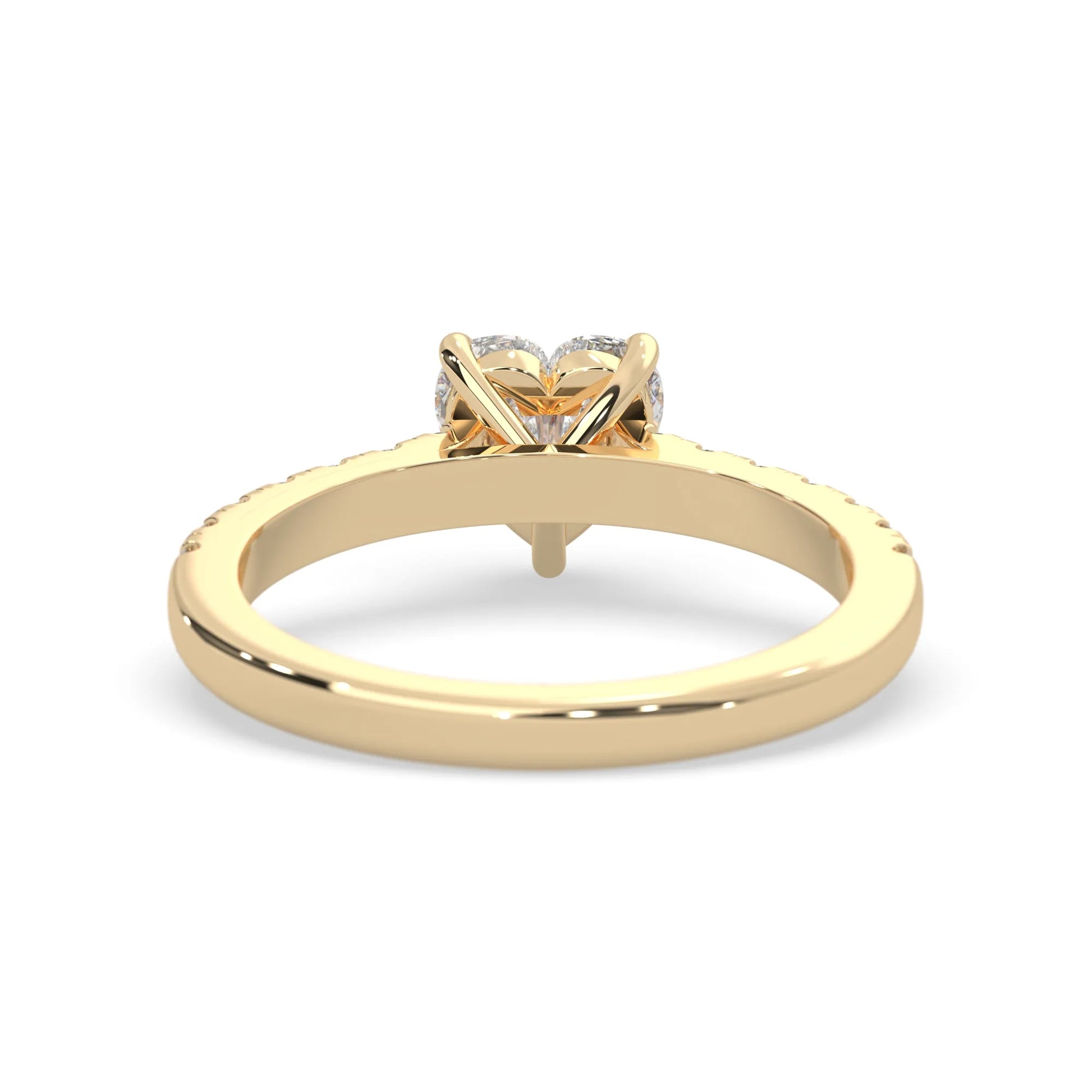 heart cut lab grown diamond prong set engagement ring with pavé band and yellow gold metal tone design