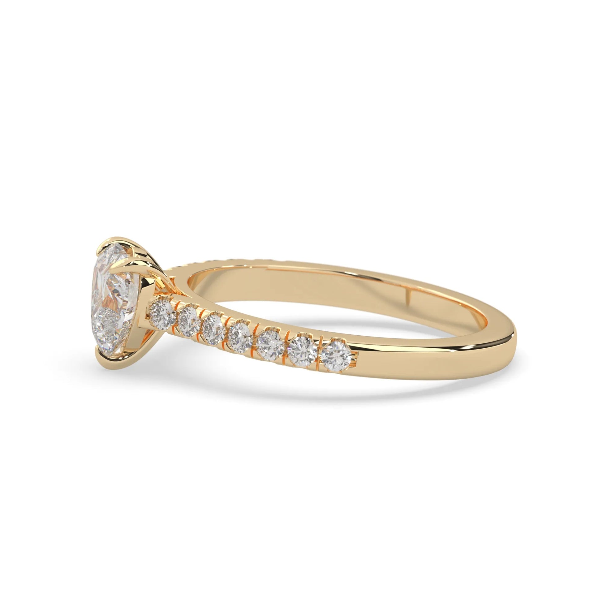 heart cut lab grown diamond prong set engagement ring with pavé band and yellow gold metal tone design