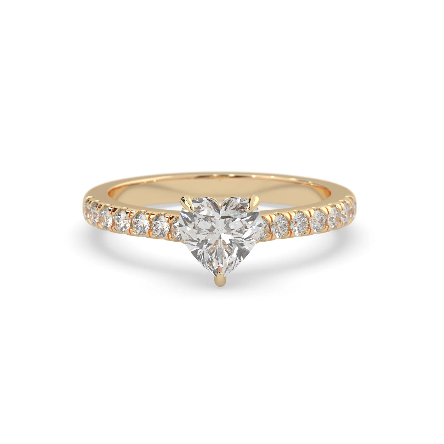 heart cut lab grown diamond prong set engagement ring with pavé band and yellow gold metal tone design
