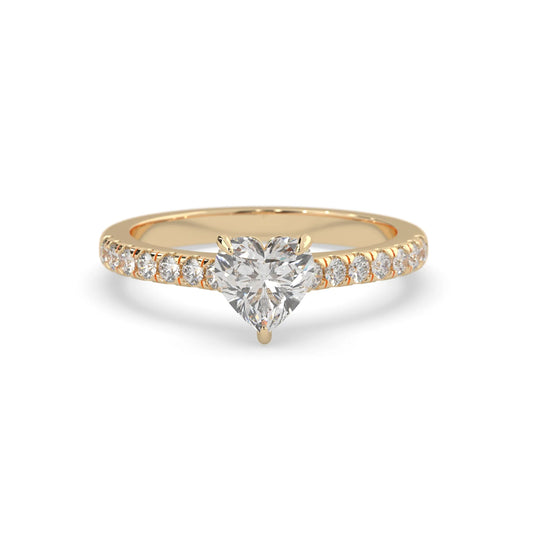 heart cut lab grown diamond prong set engagement ring with pavé band and yellow gold metal tone design