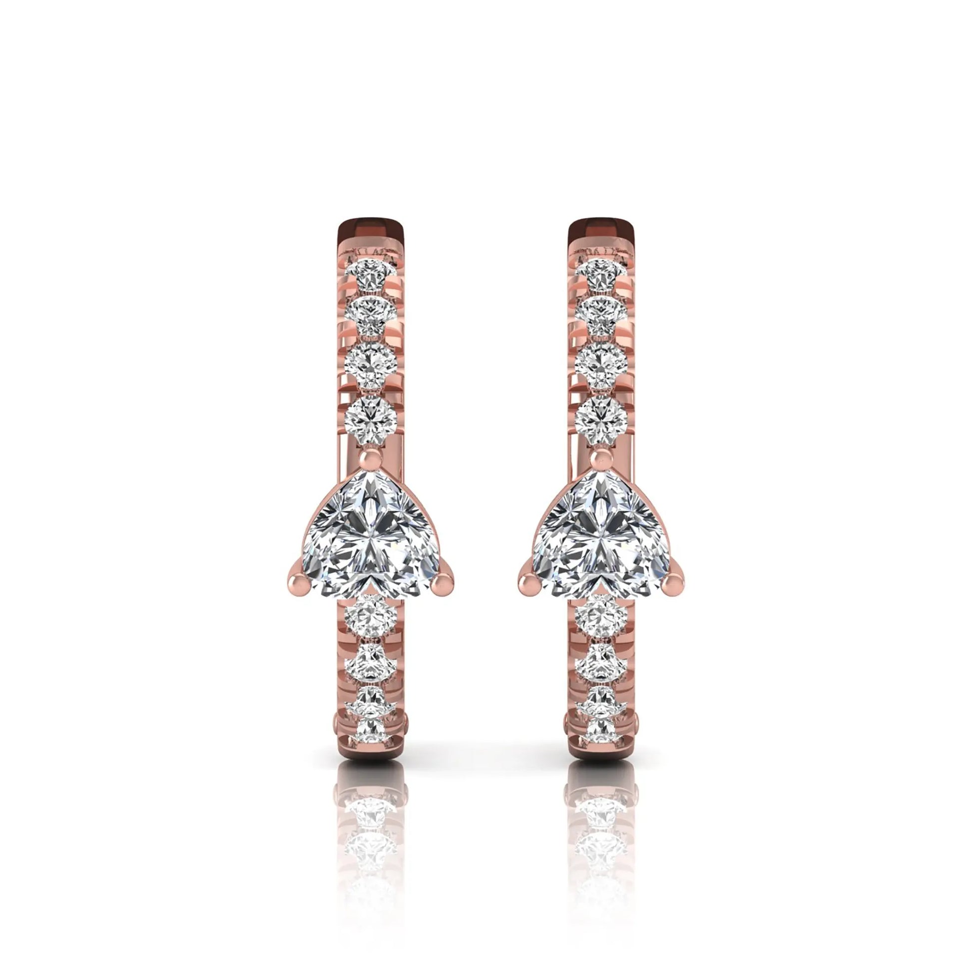 Heart and round cut lab grown diamond pavé huggie hoop earrings featuring a front-facing heart diamond, graduated shared prong round diamonds, hinged snap closure, and polished rose gold finish.