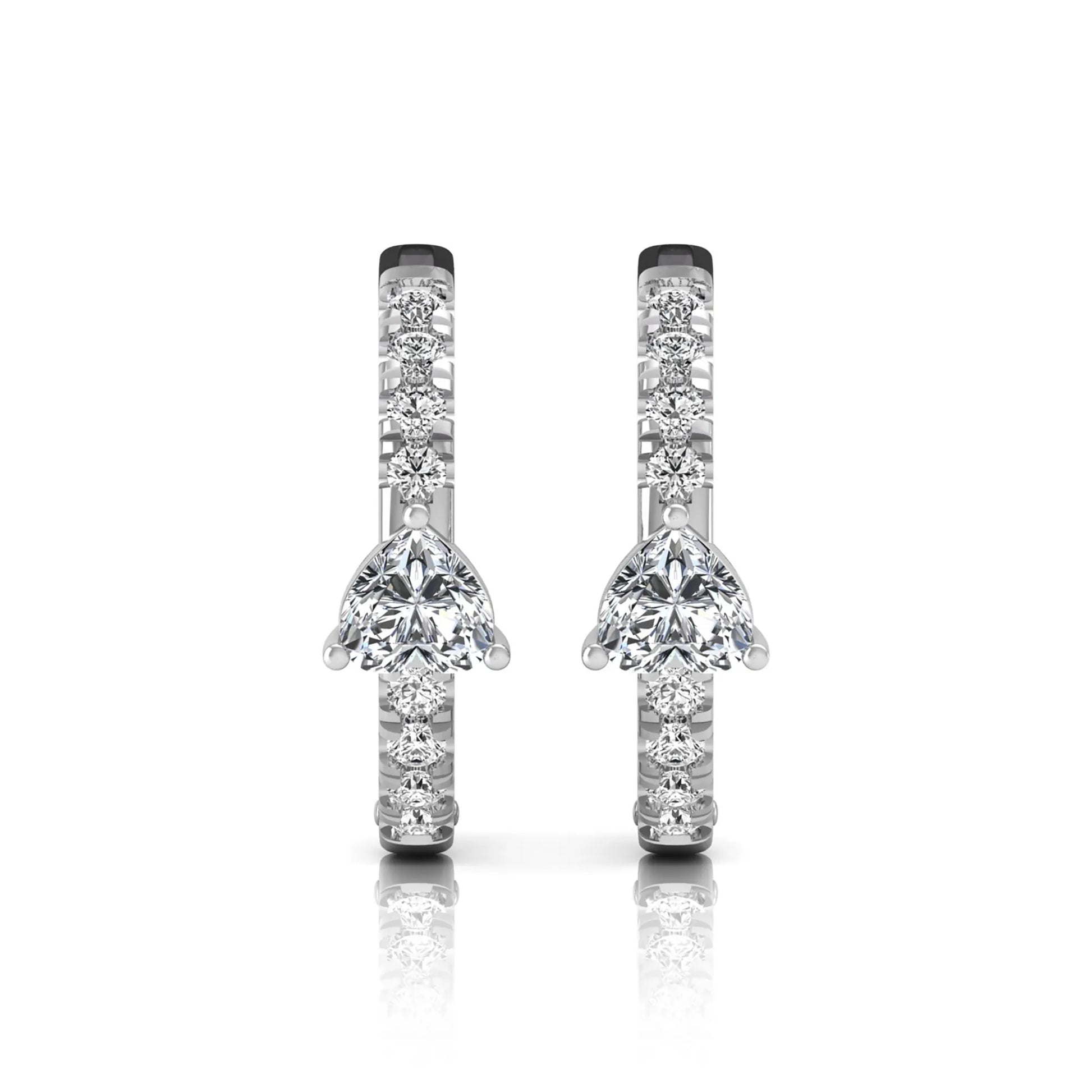 Heart and round cut lab grown diamond pavé huggie hoop earrings featuring a front-facing heart diamond, graduated shared prong round diamonds, hinged snap closure, and polished white gold finish.