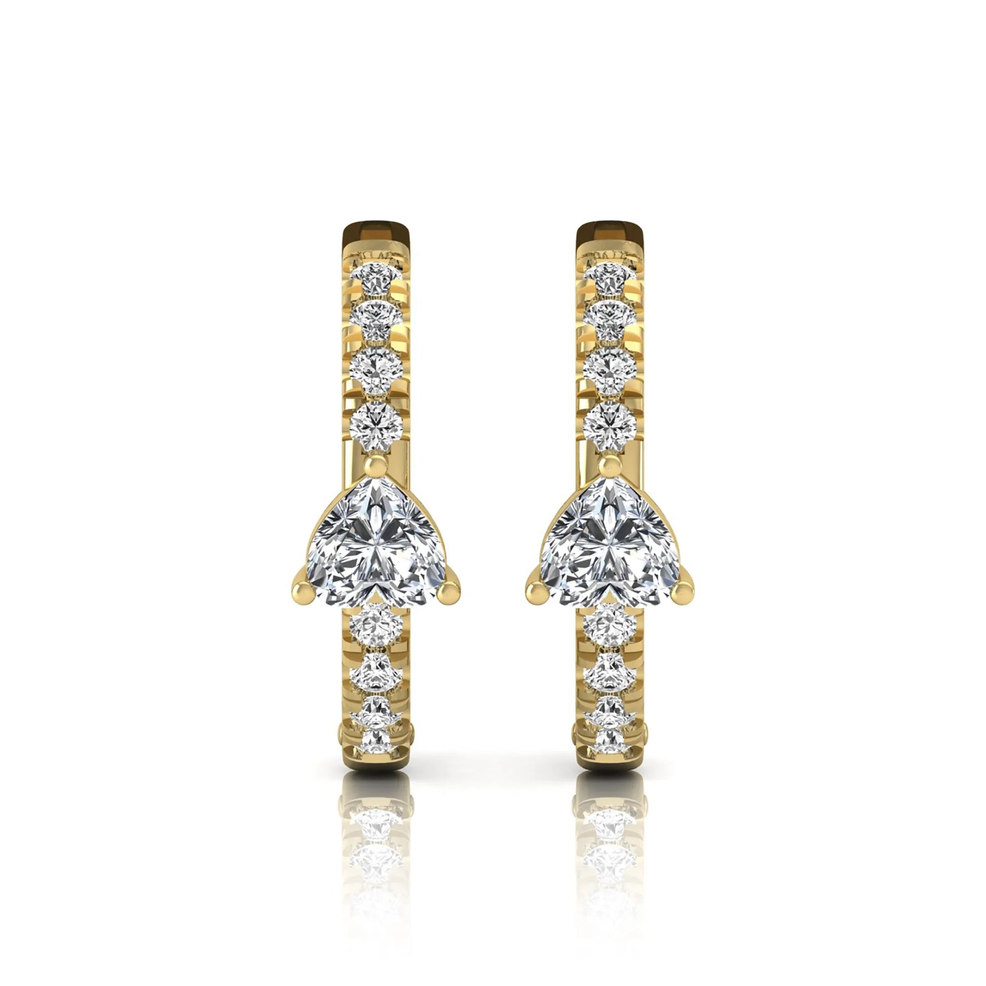 Heart and round cut lab grown diamond pavé huggie hoop earrings featuring a front-facing heart diamond, graduated shared prong round diamonds, hinged snap closure, and polished yellow gold finish.