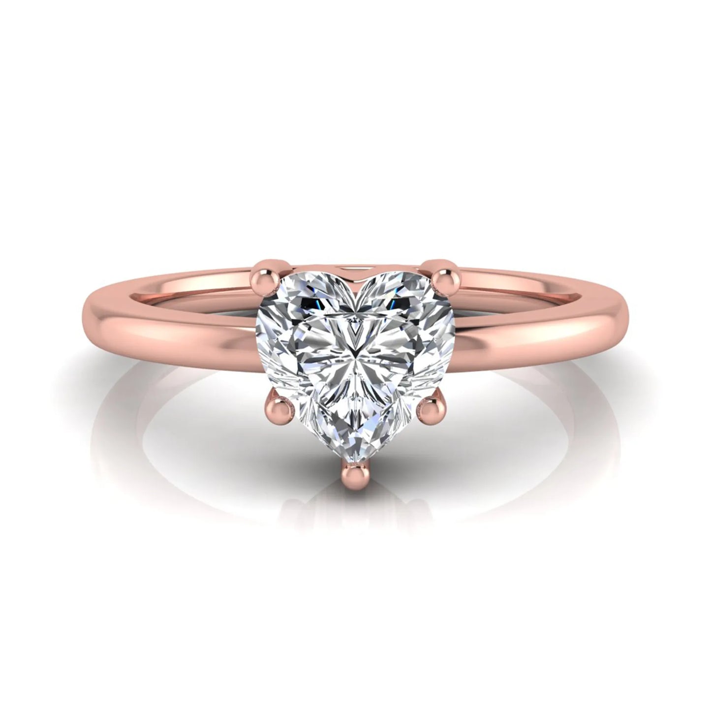 Heart cut lab grown diamond engagement ring featuring a 0.93 carat IGI certified center diamond in an elegant three-prong solitaire setting with a polished rose gold band.
