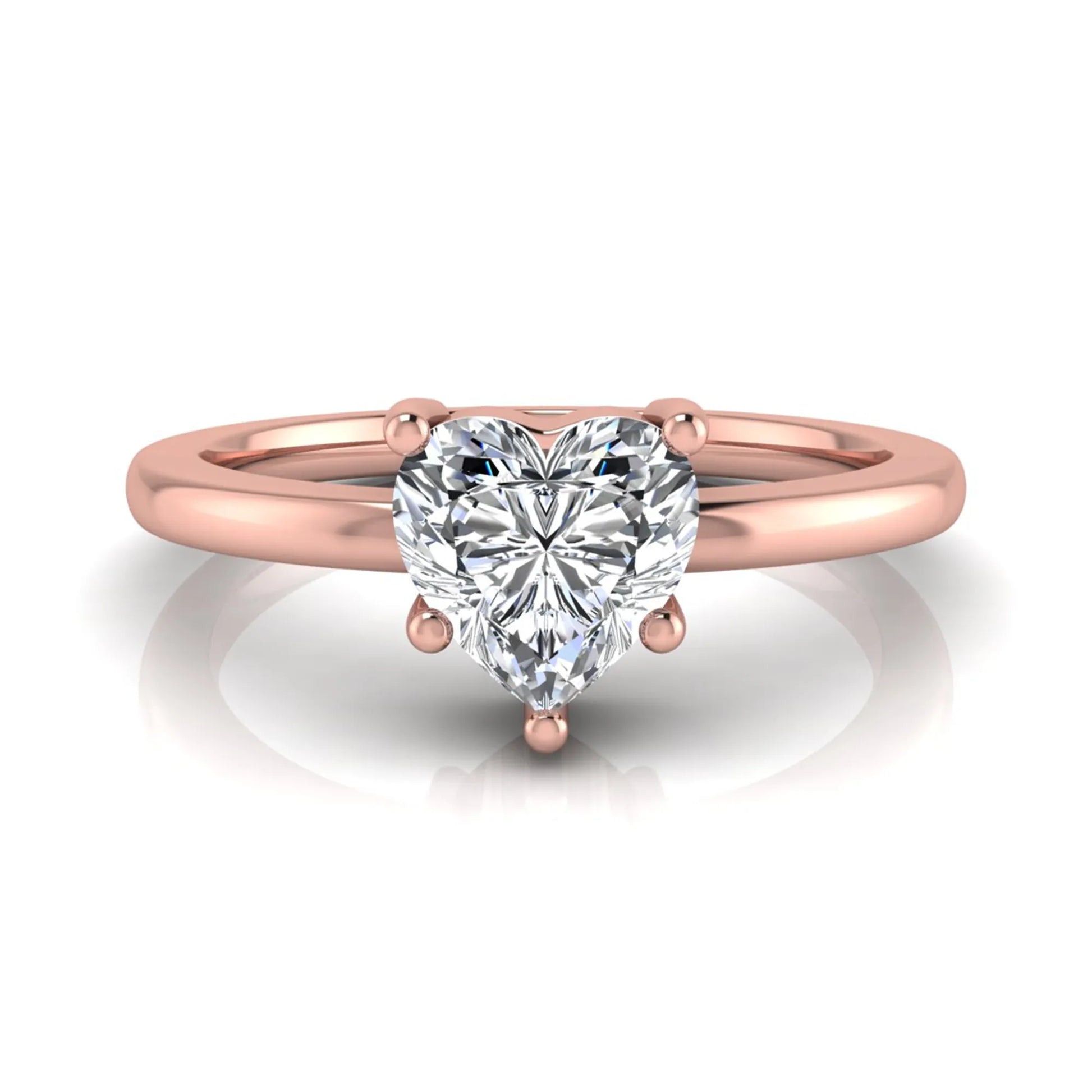 Heart cut lab grown diamond engagement ring featuring a 0.93 carat IGI certified center diamond in an elegant three-prong solitaire setting with a polished rose gold band.