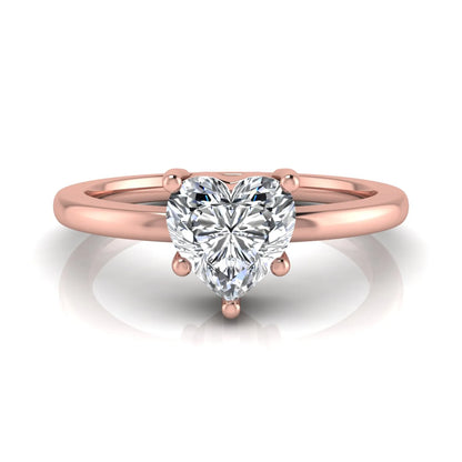 Heart cut lab grown diamond engagement ring featuring a 0.93 carat IGI certified center diamond in an elegant three-prong solitaire setting with a polished rose gold band.