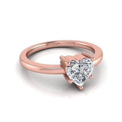 Heart cut lab grown diamond engagement ring featuring a 0.93 carat IGI certified center diamond in an elegant three-prong solitaire setting with a polished rose gold band.
