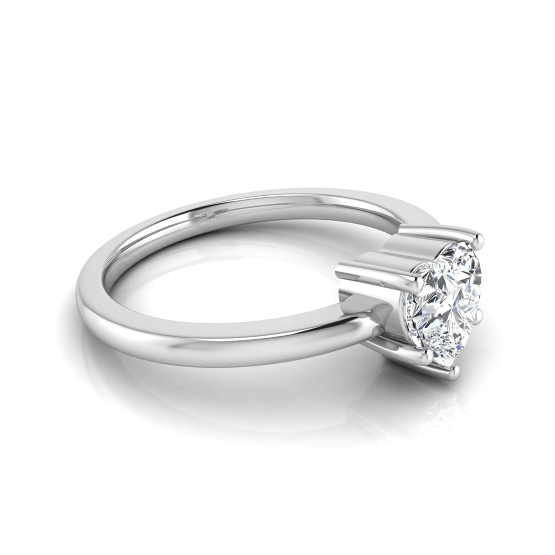 Heart cut lab grown diamond engagement ring featuring a 0.93 carat IGI certified center diamond in an elegant three-prong solitaire setting with a polished white gold band.