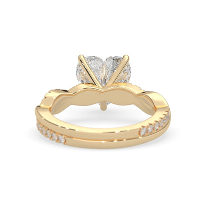 Heart brilliant lab grown diamond engagement ring with prong setting and twisted pavé diamond band in yellow gold tone