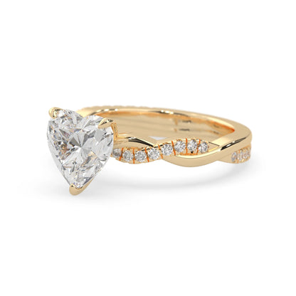 Heart brilliant lab grown diamond engagement ring with prong setting and twisted pavé diamond band in yellow gold tone